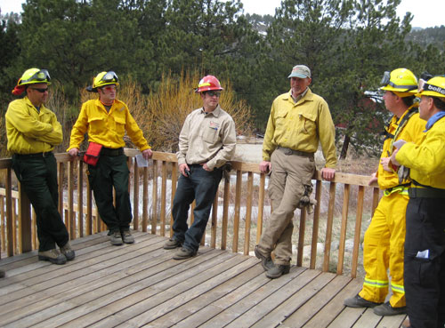 A few of the S-131/133/211 students gather with the instructors before going out to complete the portable pumps field exercise.