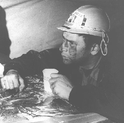 FC-Suppression. Shoshone NF, Wyoming. Line boss, Niel Edstrom, discussing Cut Coulee Fire perimeter. Taken by George C. Hinton, October 15, 1964.